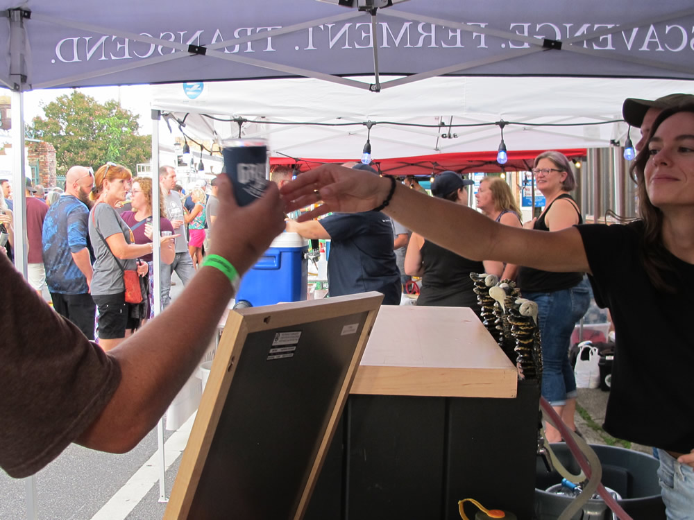 Main Street - Passing beer samples at the Emerald Coast Beer Fest